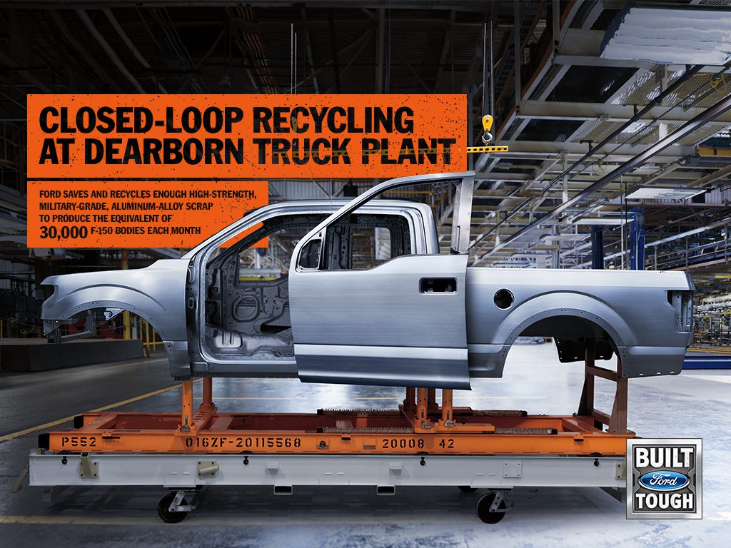 Silver truck frame on assembly line in recycling plant.