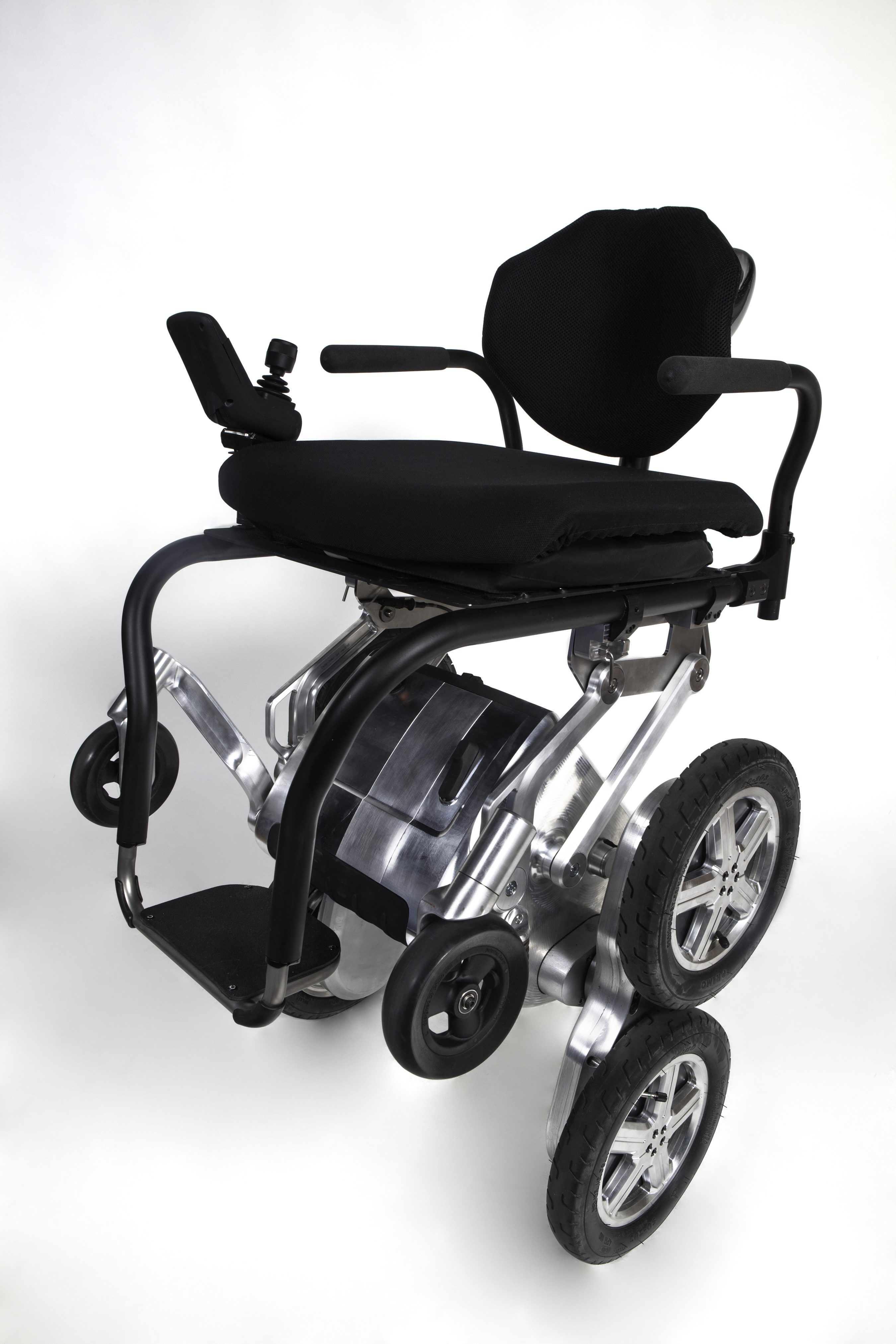 Modern electric wheelchair with sturdy wheels and ergonomic seat.