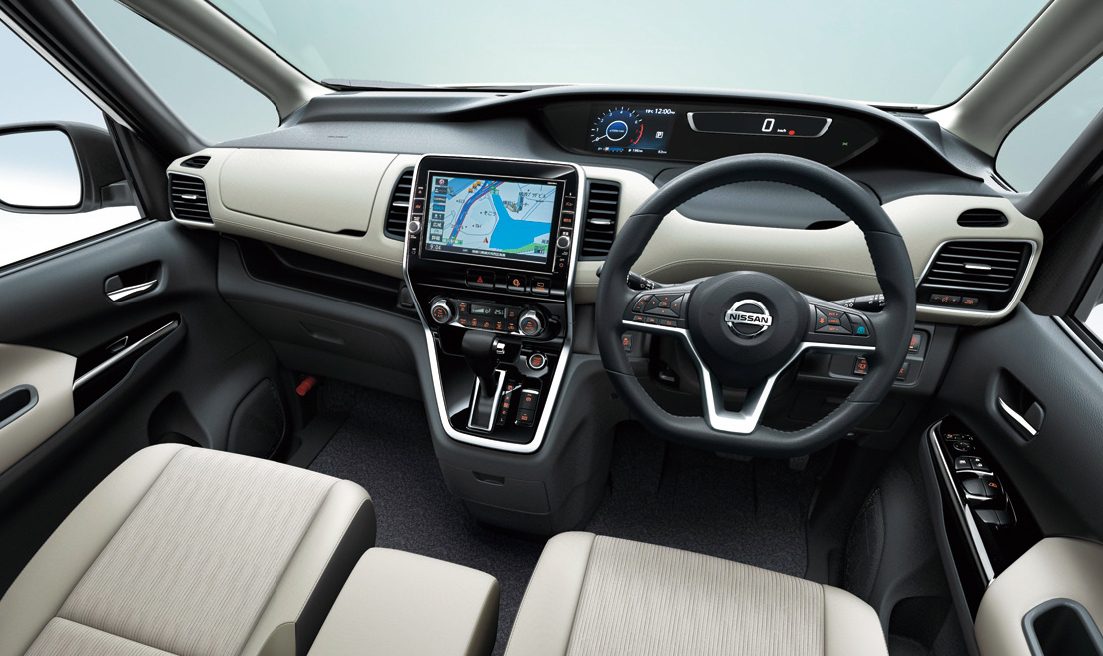 Modern car interior with digital dashboard and touchscreen navigation.