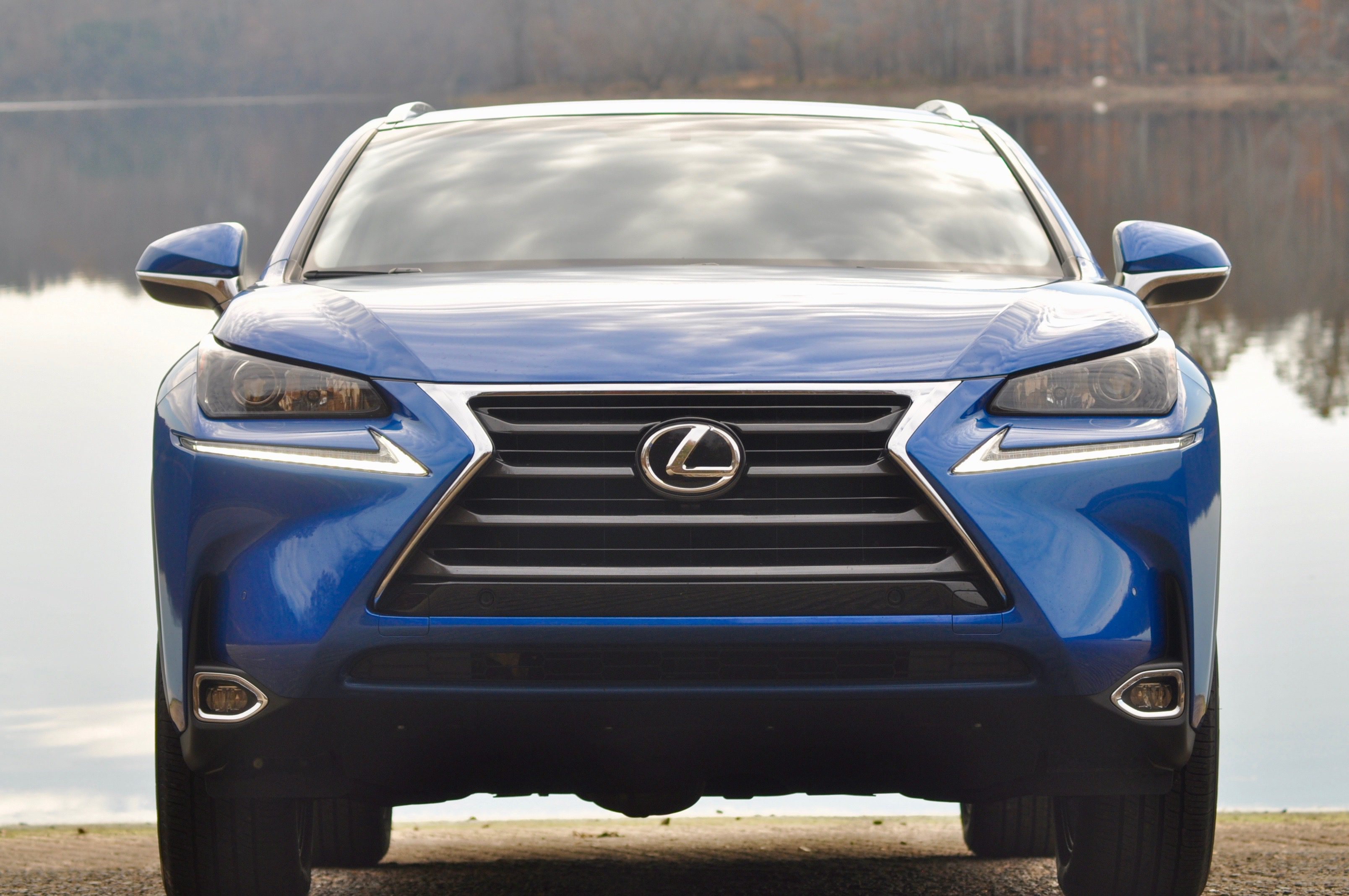 Front view of a blue Lexus SUV with distinctive grille and sleek headlights.