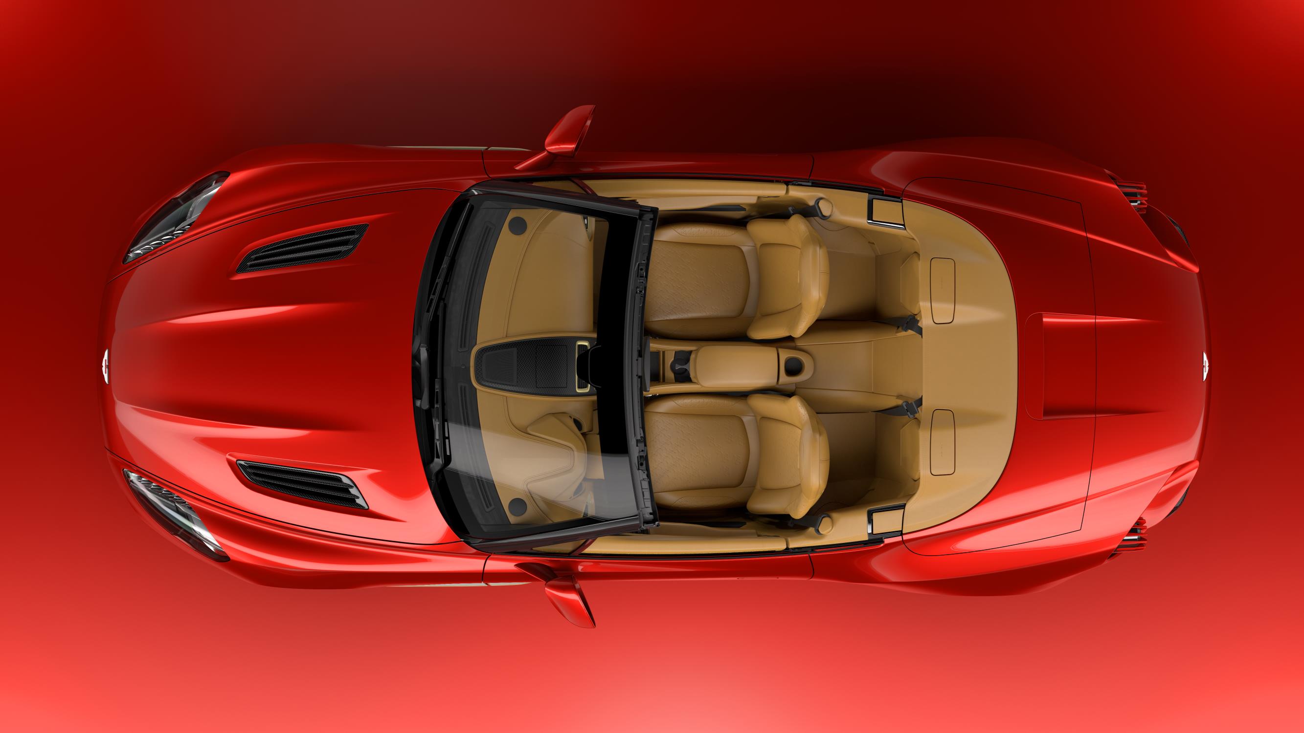 Top view of a red convertible car with beige interior and four seats.