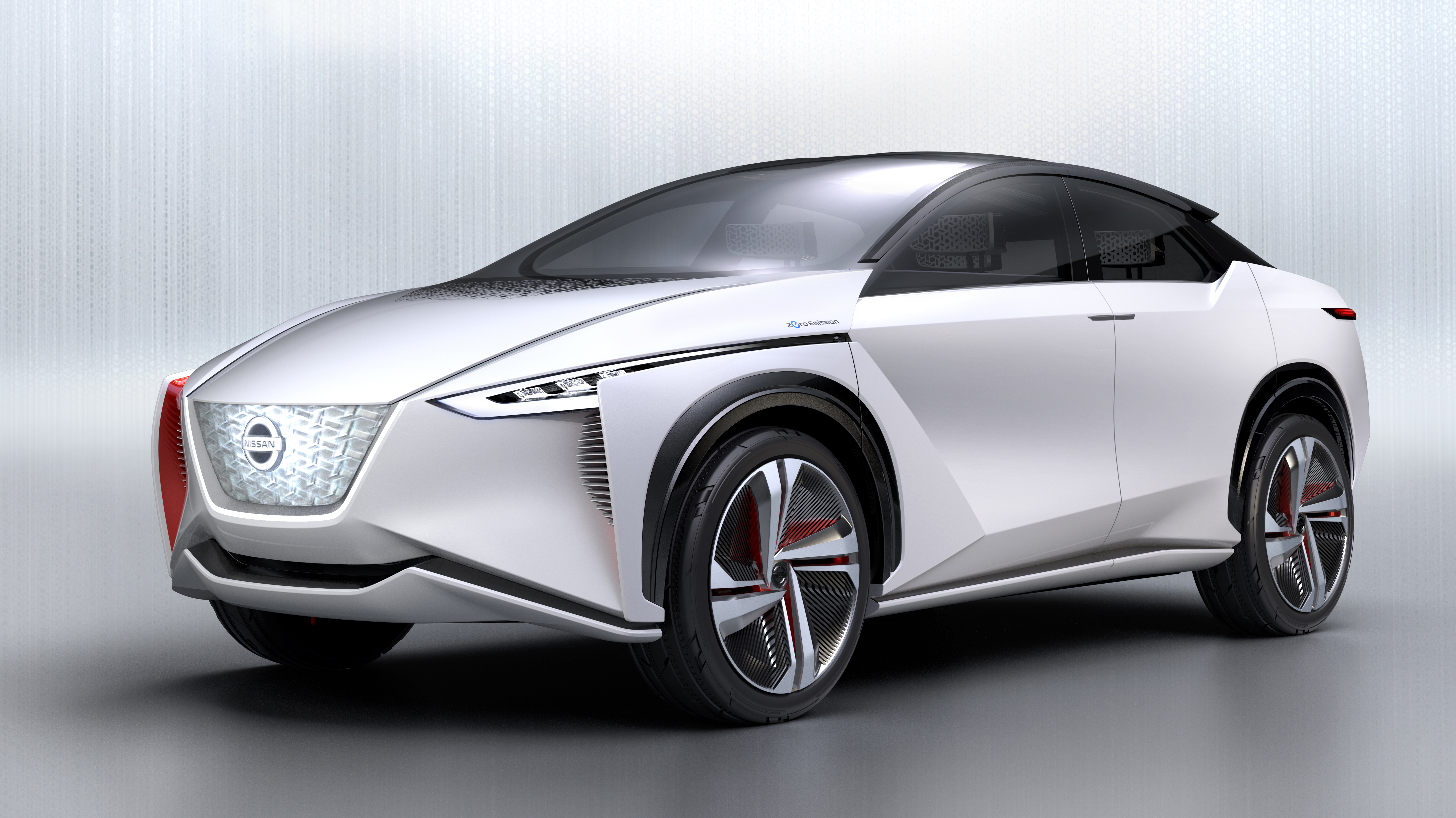 Sleek white futuristic electric car with aerodynamic design and modern LED lights.