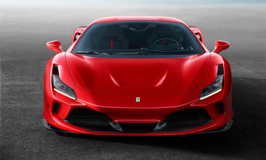 A sleek red Ferrari sports car with aerodynamic design.