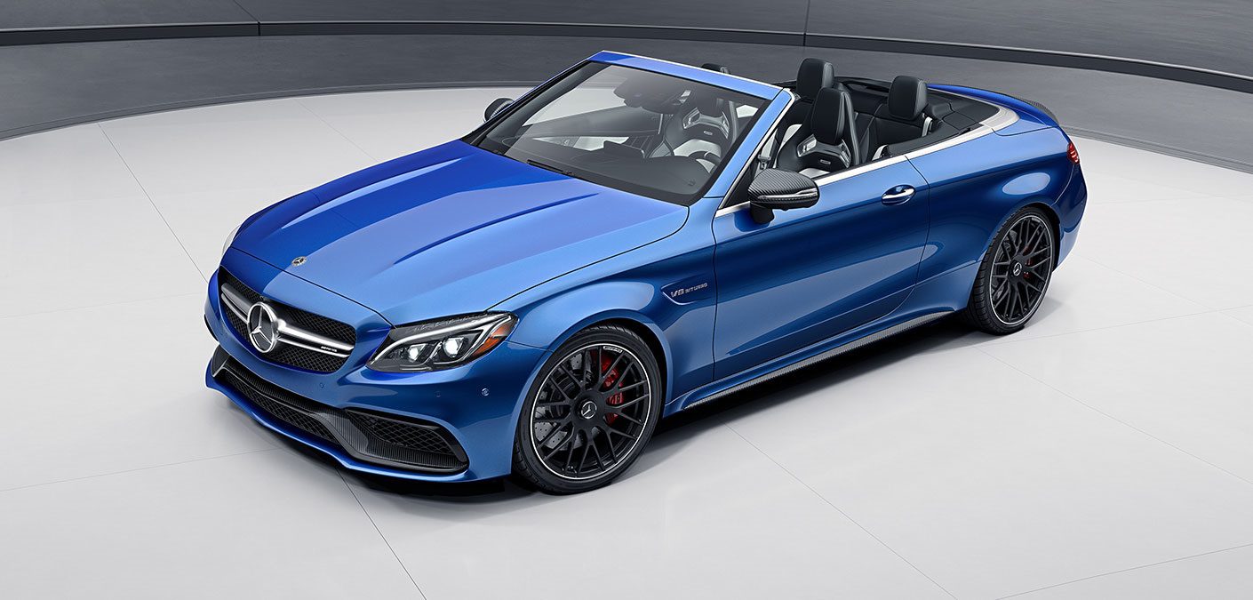 A sleek blue convertible sports car with black rims and a stylish design.