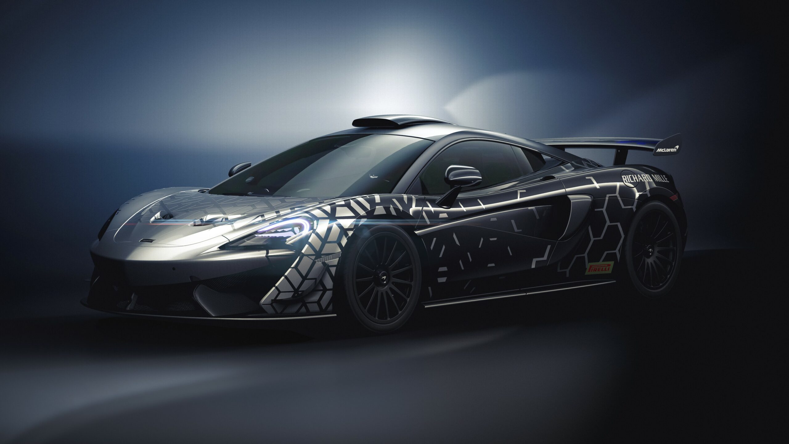 A sleek black sports car with futuristic designs and glowing accents.