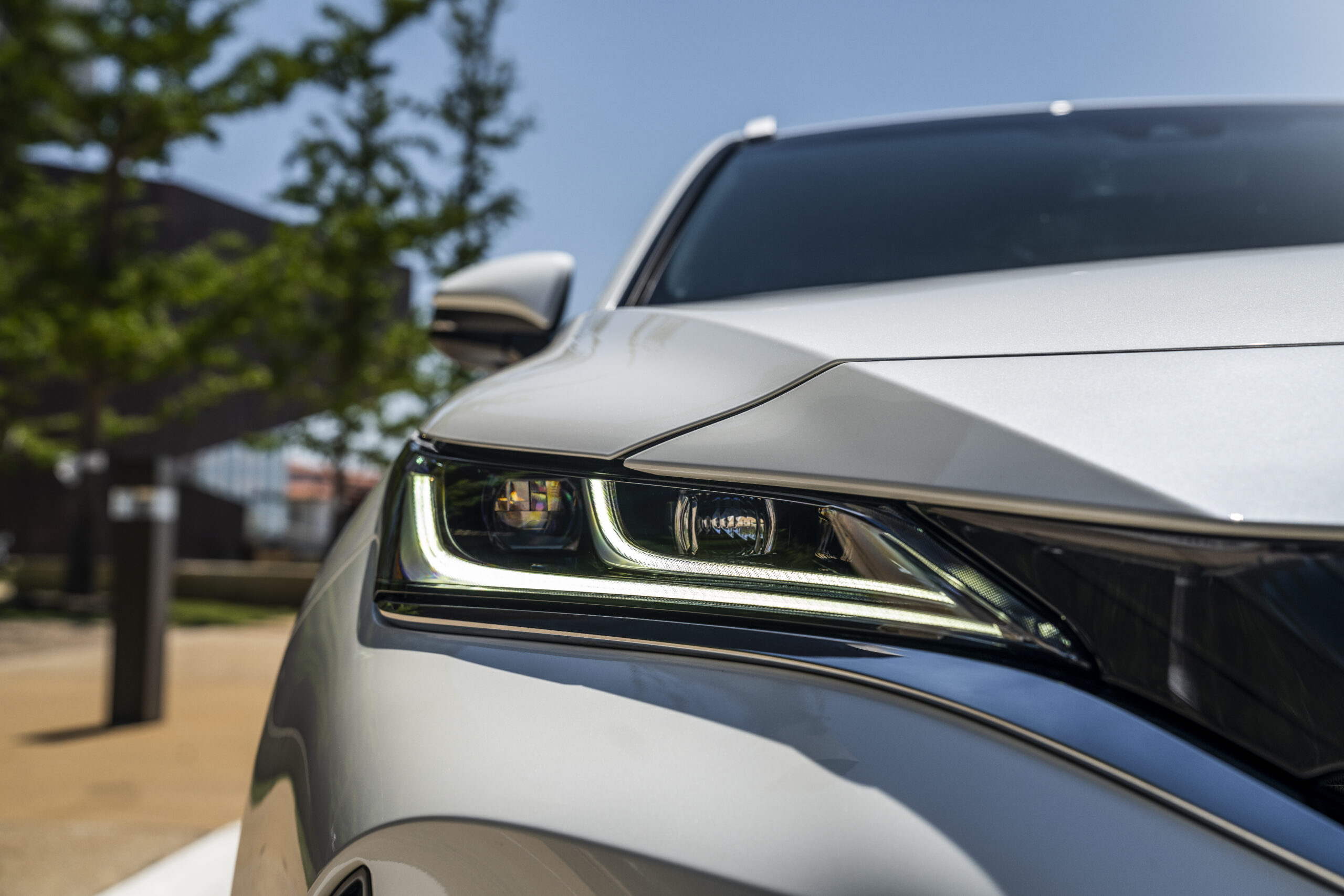 Close-up of a sleek car headlight with modern design.