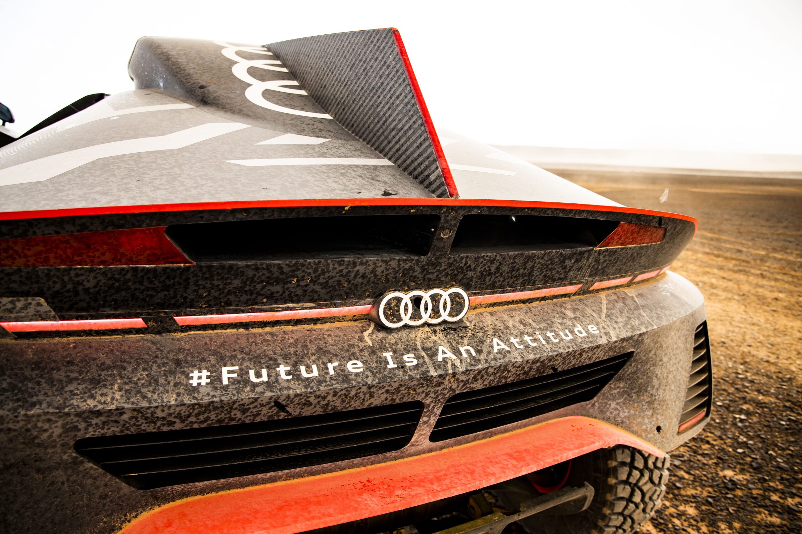 Close-up of an Audi car rear with #FutureIsAnAttitude hashtag.