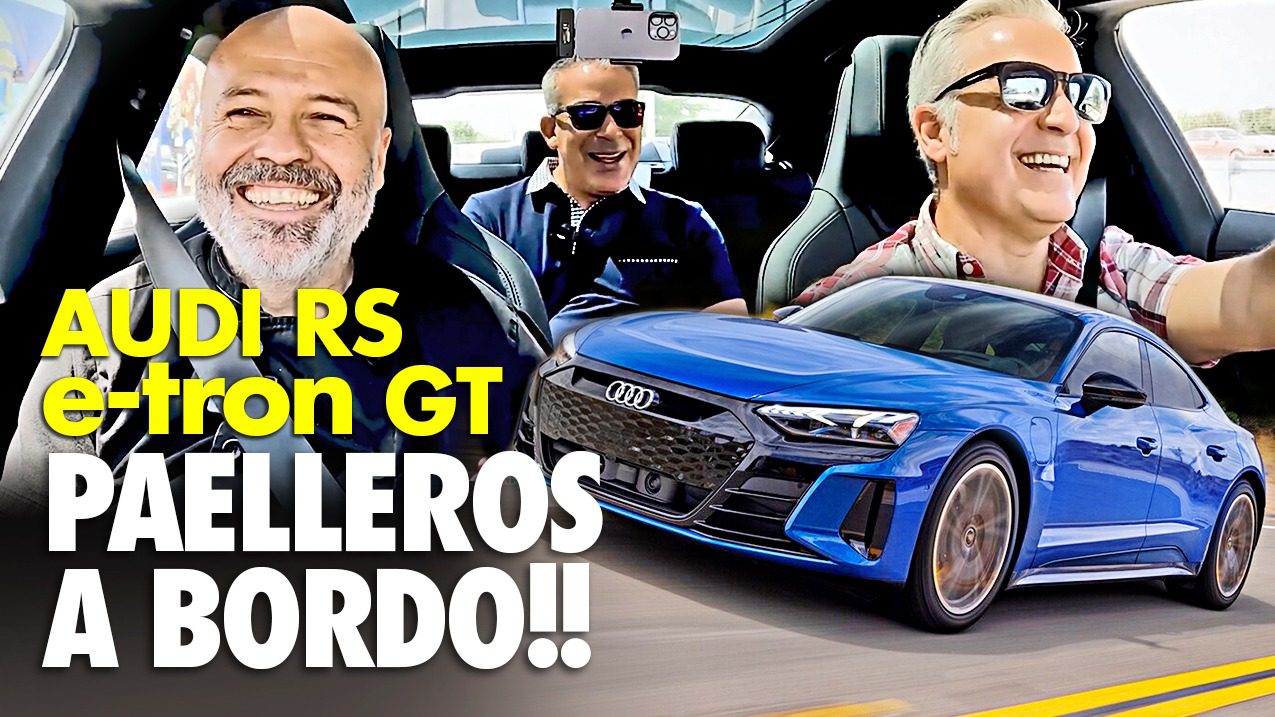 Three men enjoying a ride in a blue Audi RS e-tron GT convertible.