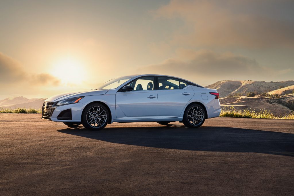 Image: 2023 Nissan Altima SR Front Fascia
Description: A close-up view of the new front fascia of the 2023 Nissan Altima SR, featuring a sporty V-Motion grille and updated brand logo.