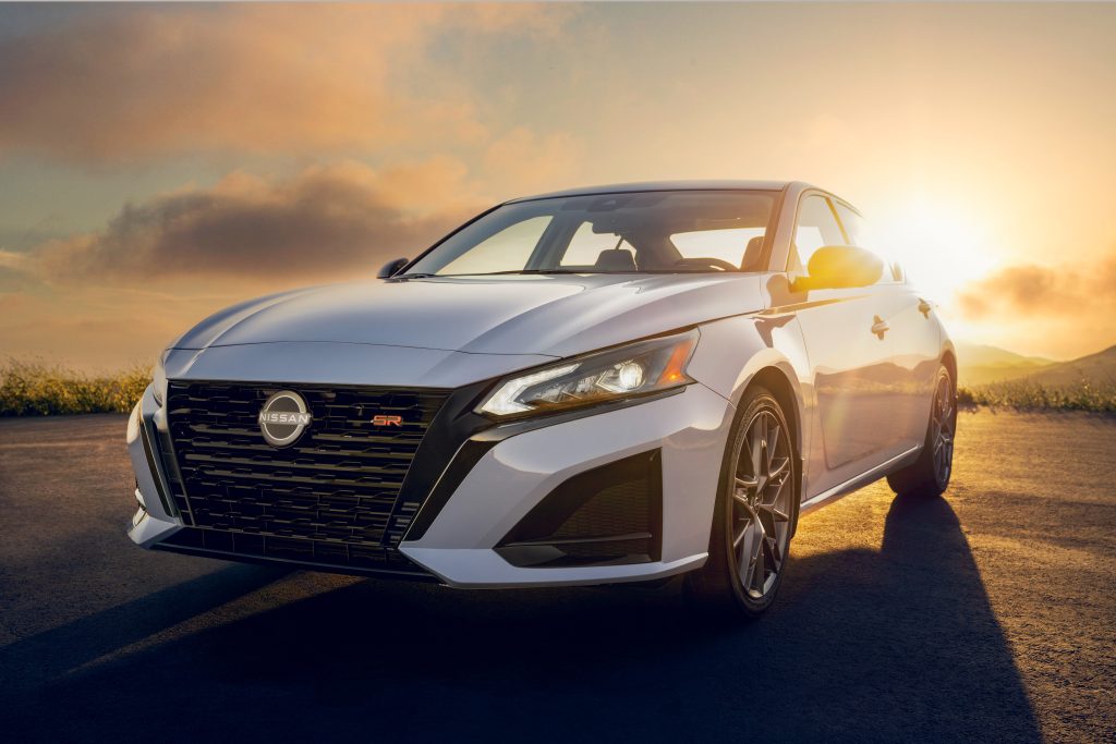 Image: 2023 Nissan Altima SR Front Fascia
Description: A close-up view of the new front fascia of the 2023 Nissan Altima SR, featuring a sporty V-Motion grille and updated brand logo.