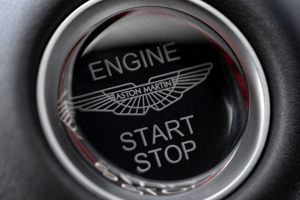 Aston Martin DBX707 logo on the steering wheel: "Elegant Aston Martin logo featured on the steering wheel of the DBX707, representing prestige and exclusivity."