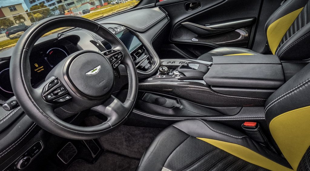 Interior shot of Aston Martin DBX707 with plush leather seats: "Luxurious interior of the Aston Martin DBX707 featuring sumptuous leather seats, exemplifying bespoke craftsmanship."