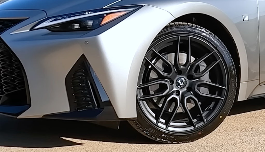 Striking exterior design of the 2023 Lexus IS350 AWD F Sport, featuring bold lines and distinctive L-shaped headlights.