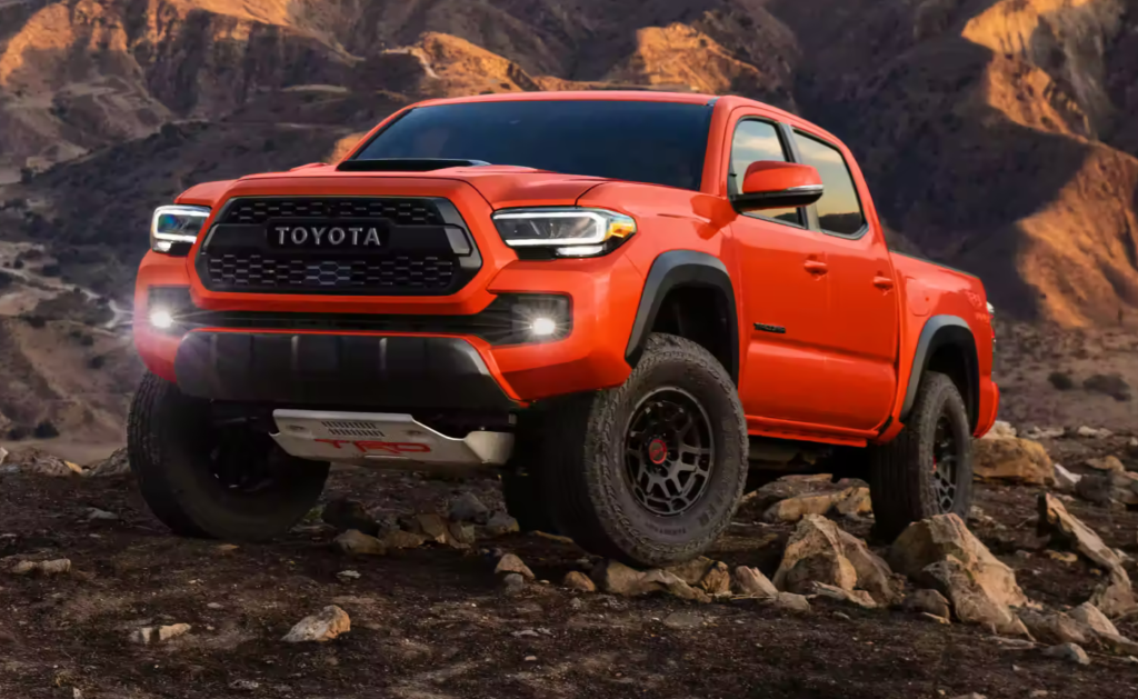 2023 Toyota Tacoma TRD Pro Double Cab: Commanding and Bold Design with Heritage-Inspired Front Grille and Solar Octane Color Option.