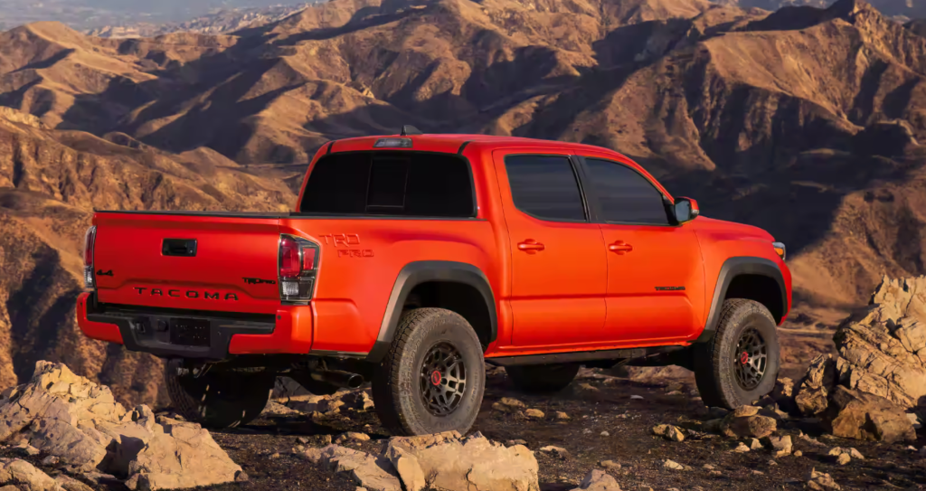 2023 Toyota Tacoma TRD Pro Double Cab: Commanding and Bold Design with Heritage-Inspired Front Grille and Solar Octane Color Option.