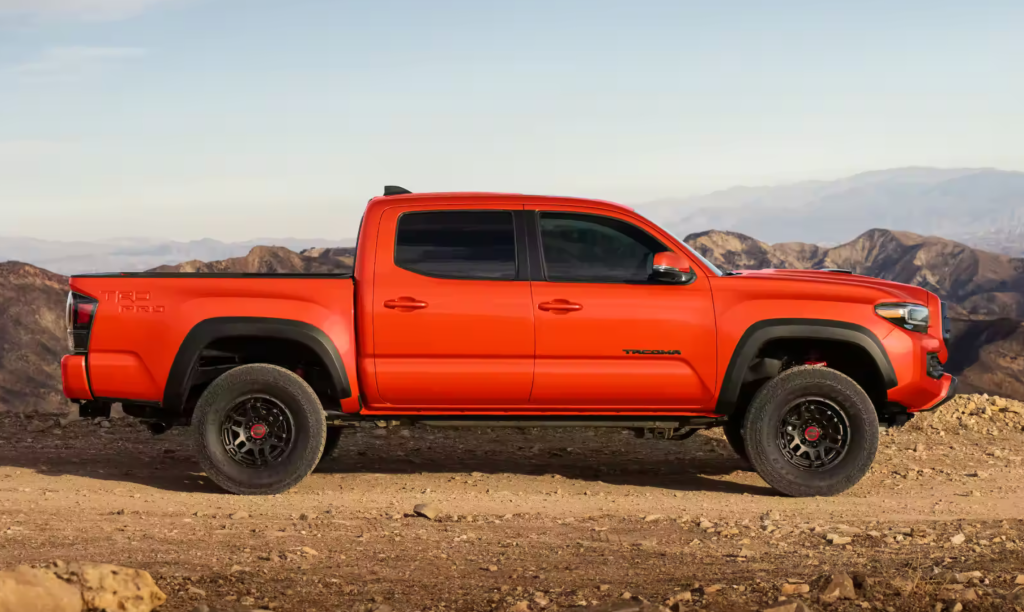 2023 Toyota Tacoma TRD Pro Double Cab: Commanding and Bold Design with Heritage-Inspired Front Grille and Solar Octane Color Option.