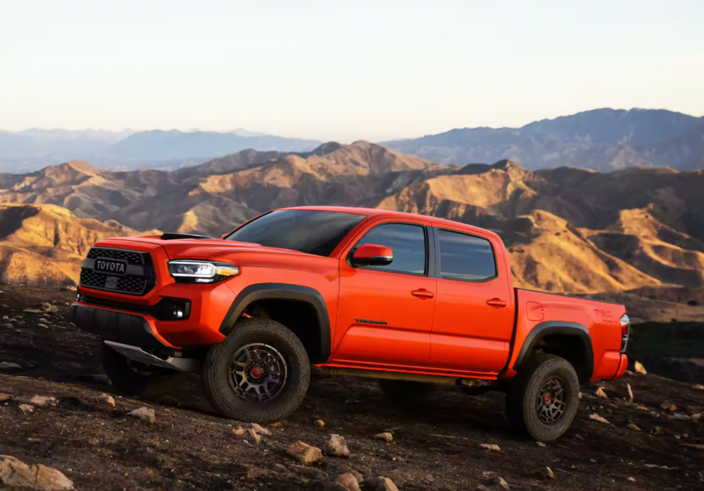 2023 Toyota Tacoma TRD Pro Double Cab: Commanding and Bold Design with Heritage-Inspired Front Grille and Solar Octane Color Option.