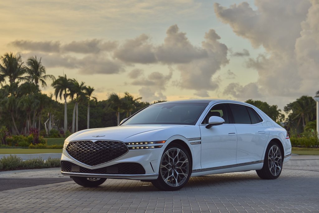 Front view of the 2023 Genesis G90, showcasing its bold grille, sleek lines, and LED headlights, embodying modern luxury