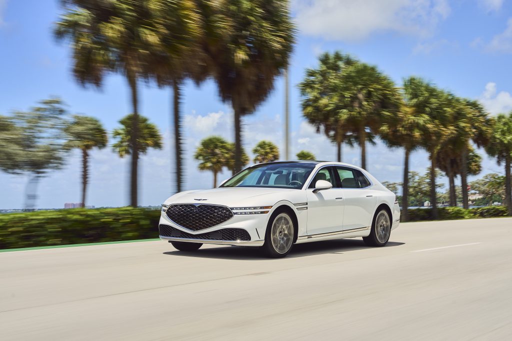 Front view of the 2023 Genesis G90, showcasing its bold grille, sleek lines, and LED headlights, embodying modern luxury