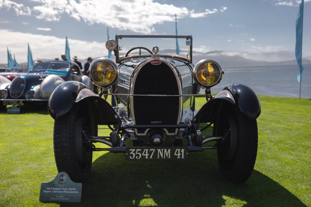 Exquisite craftsmanship and detail in Bugatti's iconic vehicles showcased at Pebble Beach Concours d'Elegance.