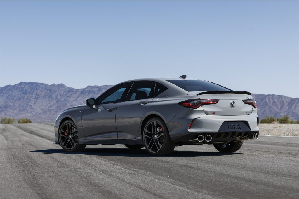 2024 Acura TLX Sport Sedan's stylish rear design with dual exhaust finishers and spoiler