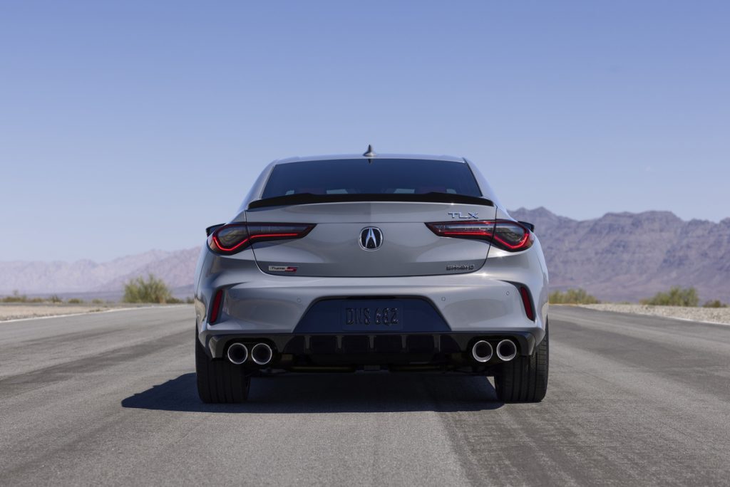 2024 Acura TLX Sport Sedan's stylish rear design with dual exhaust finishers and spoiler