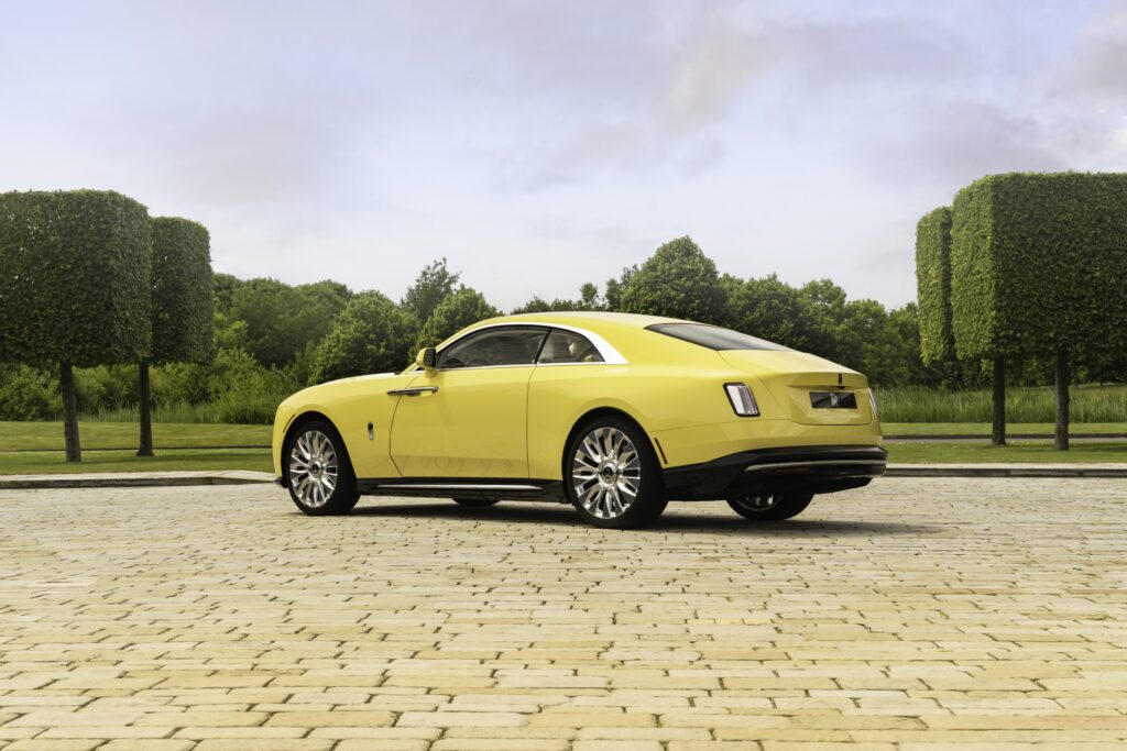 Rolls-Royce Spectre Semaphore in vibrant Semaphore Yellow with unique Marbled Paint Spill artwork on the bonnet, showcasing luxury craftsmanship at Monterey Car Week 2024