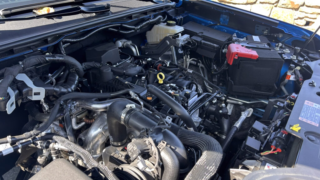 A dynamic image showcasing the **2024 Ford Ranger XLT SuperCrew 4x4** in **Velocity Blue Metallic**, featuring its rugged design, **off-road capability**, and **EcoBoost engine**. The truck is equipped with the **FX4 package**, offering **superior performance** on various terrains. Highlighted elements include **SYNC4 technology**, **towing capacity**, and the vehicle's **mid-size truck versatility**. Perfect for those seeking adventure, durability, and advanced **tech features** in a pickup.