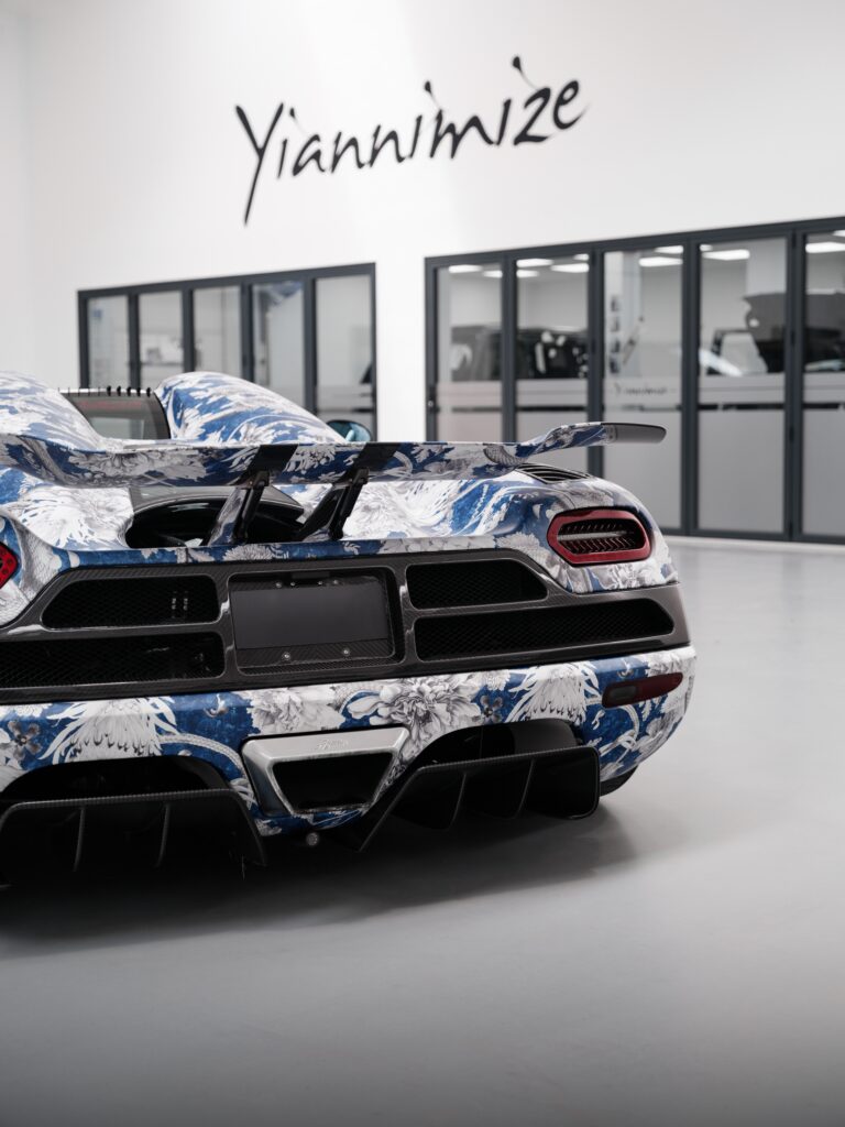 Stunning custom Koenigsegg Agera N wrapped by Yiannimize in Divine Savages design at Salon Privé 2024 – Explore more on Carsfera.com