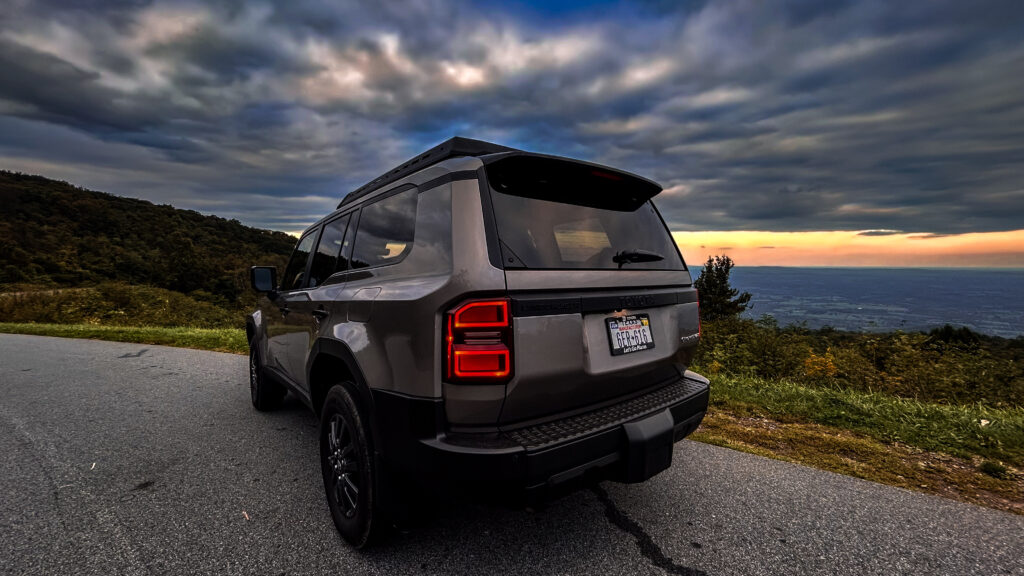 2024 Toyota Land Cruiser 1958 Edition SUV showcasing its rugged design, heritage-inspired details, and modern features, including LED headlights, boxy silhouette, and retro-styled grille. Perfect for off-road adventures and everyday driving.