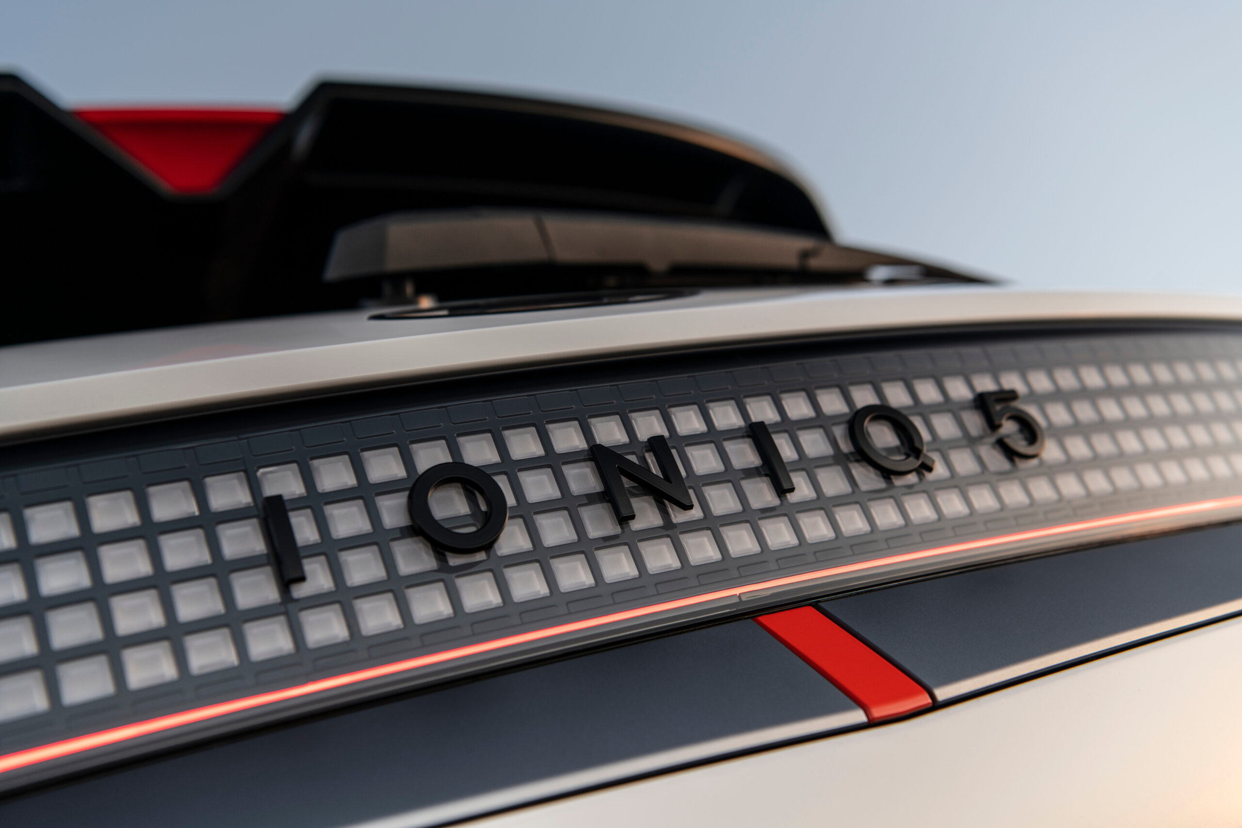 Close-up of a Honda car with detailed branding and red accent lines.