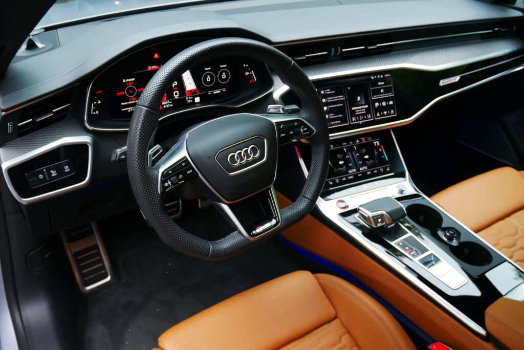 Images of the 2024 Audi RS 7 highlighting its sleek exterior design, powerful performance, luxurious interior, and advanced technology.