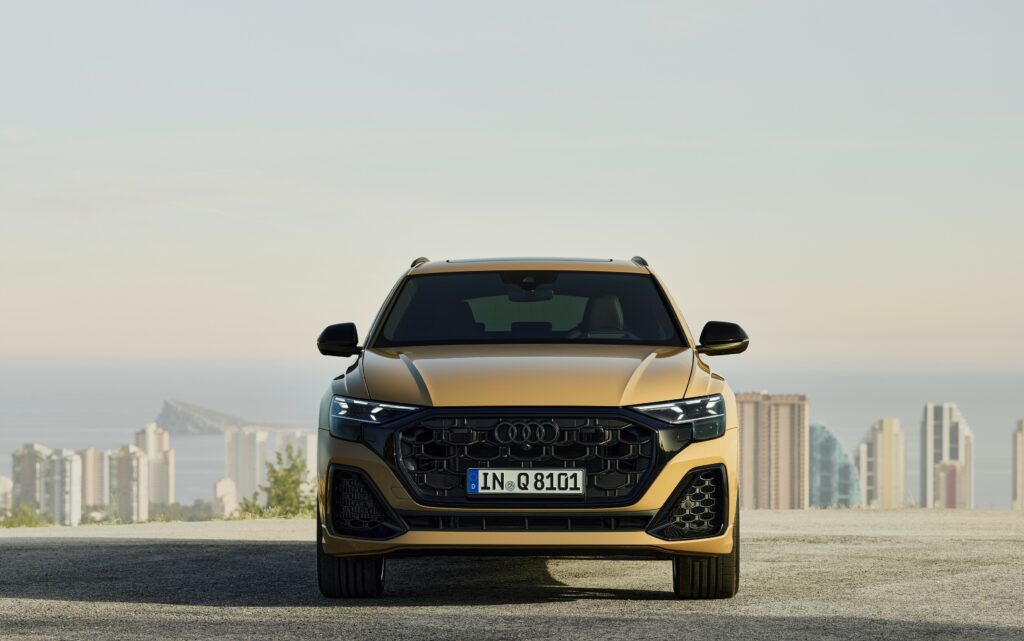 A stylish 2024 Audi Q8 55 TFSI Quattro luxury SUV showcasing its bold exterior design, high-tech interior, and performance features.