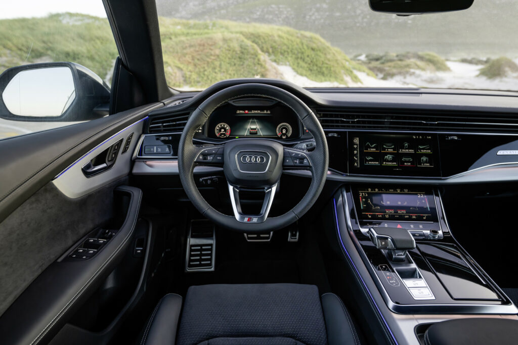 A stylish 2024 Audi Q8 55 TFSI Quattro luxury SUV showcasing its bold exterior design, high-tech interior, and performance features.