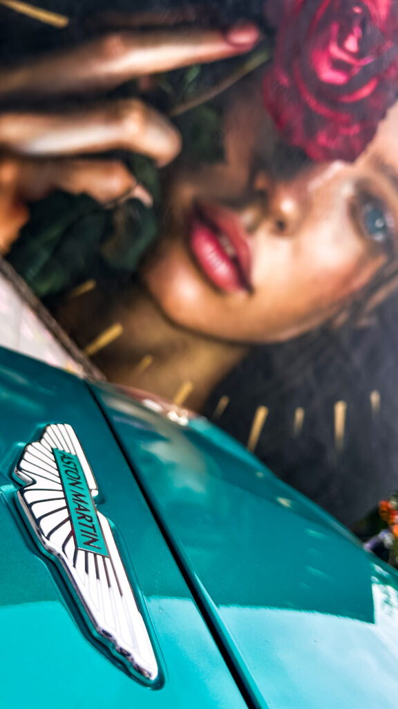 Aston Martin DB12 Volante luxury convertible photographed in Miami's Wynwood district, surrounded by vibrant street art and murals