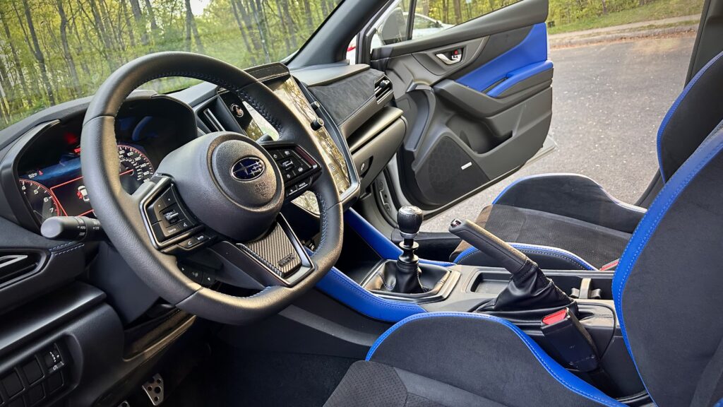 2025 Subaru WRX tS interior with Recaro Ultrasuede seats, digital gauge cluster, performance-focused cockpit