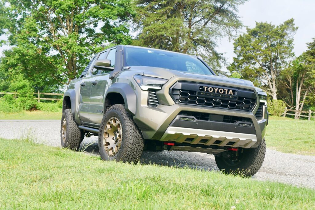 2025 Toyota Tacoma Trailhunter – factory-built overland truck with hybrid engine, ARB suspension, and off-road gear on rugged terrain