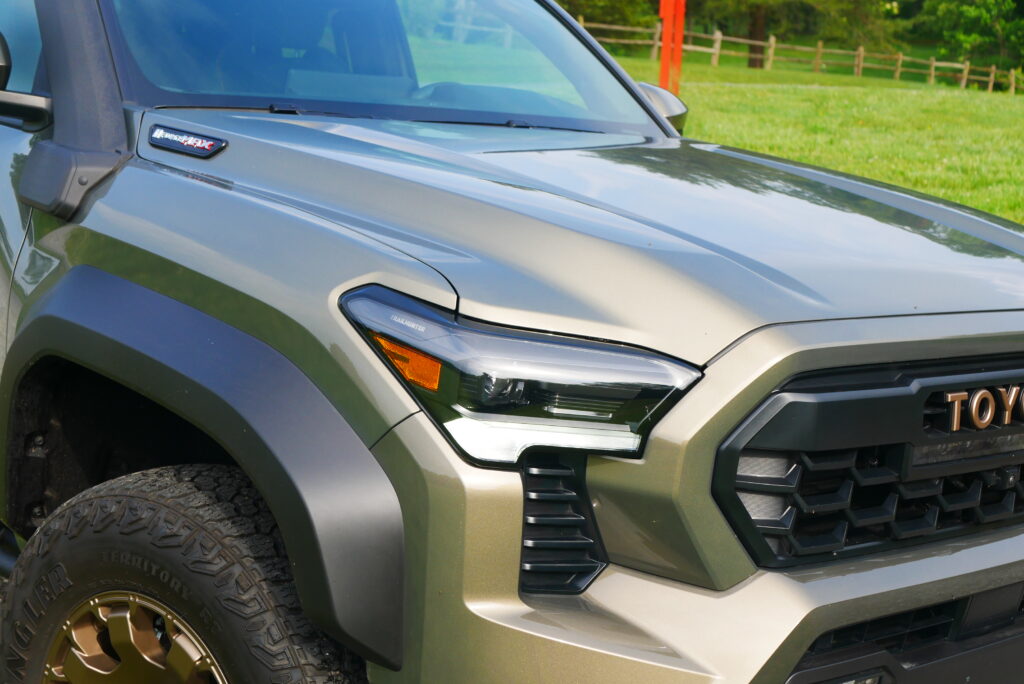 2025 Toyota Tacoma Trailhunter – factory-built overland truck with hybrid engine, ARB suspension, and off-road gear on rugged terrain