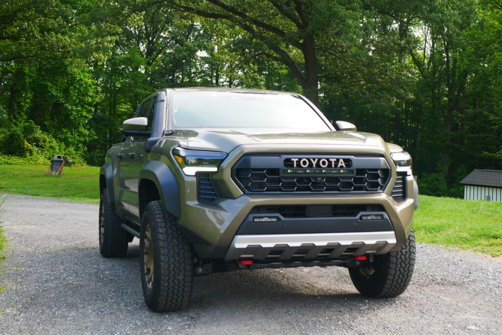2025 Toyota Tacoma Trailhunter – factory-built overland truck with hybrid engine, ARB suspension, and off-road gear on rugged terrain