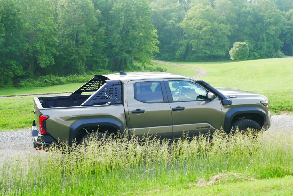 2025 Toyota Tacoma Trailhunter – factory-built overland truck with hybrid engine, ARB suspension, and off-road gear on rugged terrain