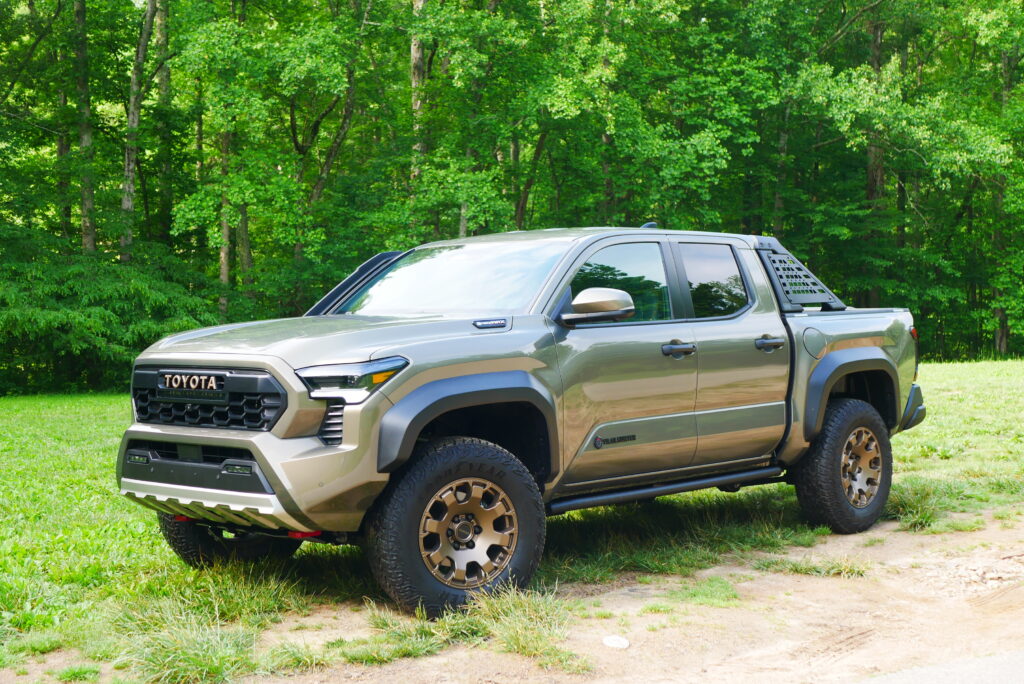 2025 Toyota Tacoma Trailhunter – factory-built overland truck with hybrid engine, ARB suspension, and off-road gear on rugged terrain