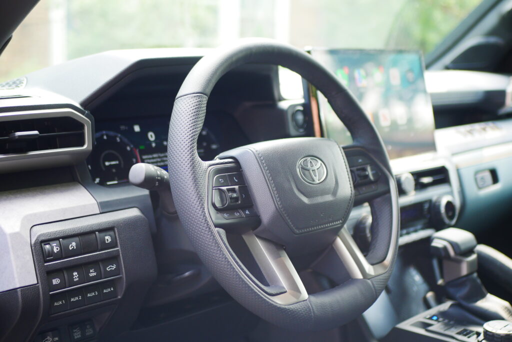 2025 Toyota Tacoma Trailhunter – factory-built overland truck with hybrid engine, ARB suspension, and off-road gear on rugged terrain