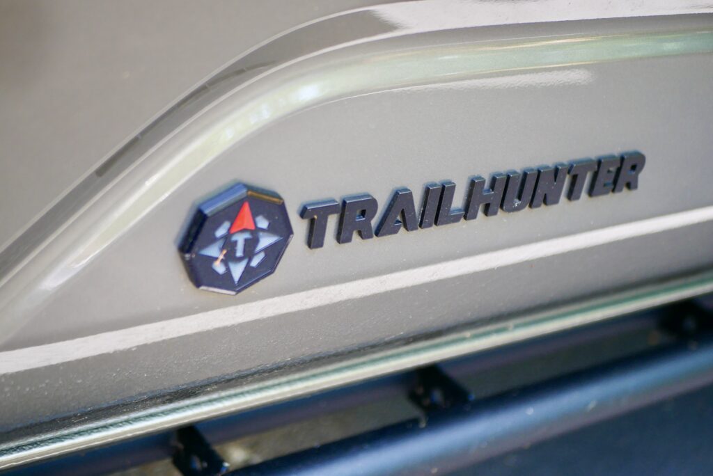 2025 Toyota Tacoma Trailhunter – factory-built overland truck with hybrid engine, ARB suspension, and off-road gear on rugged terrain