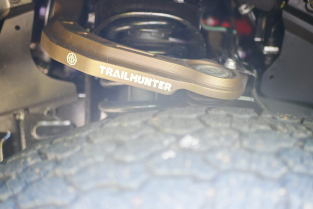 2025 Toyota Tacoma Trailhunter – factory-built overland truck with hybrid engine, ARB suspension, and off-road gear on rugged terrain