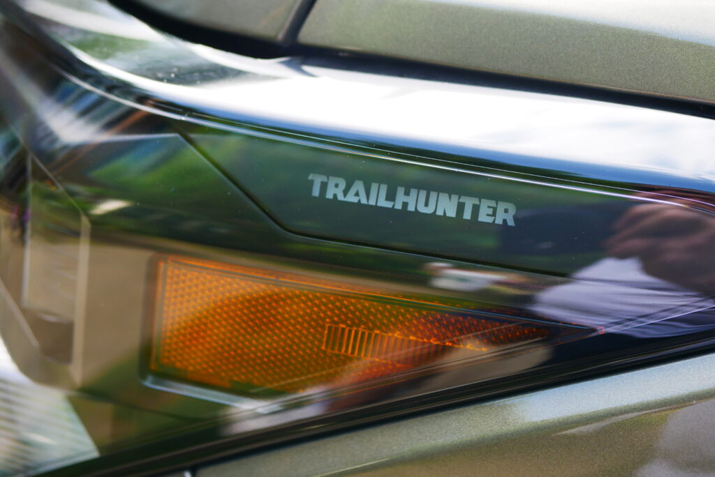 2025 Toyota Tacoma Trailhunter – factory-built overland truck with hybrid engine, ARB suspension, and off-road gear on rugged terrain