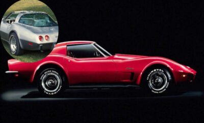 Classic red sports car with sleek design and chrome wheels.