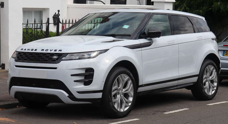 A white Range Rover Evoque parked on a city street.