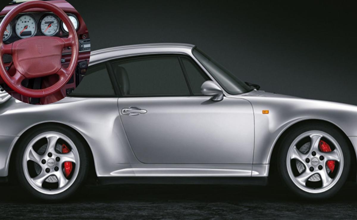 Side view of a sleek silver sports car with red brake calipers.