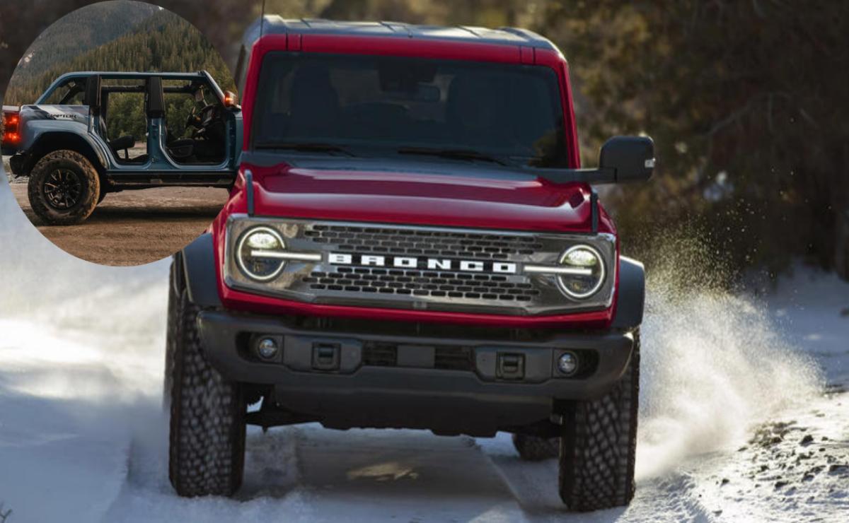 Red Ford Bronco driving on a dirt road in the wilderness.