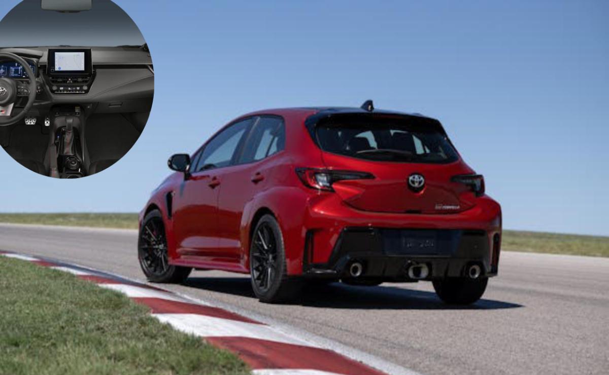 Red sporty hatchback car on a racetrack corner.
